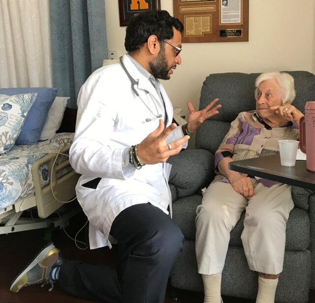 Dr. Patel working with a patient